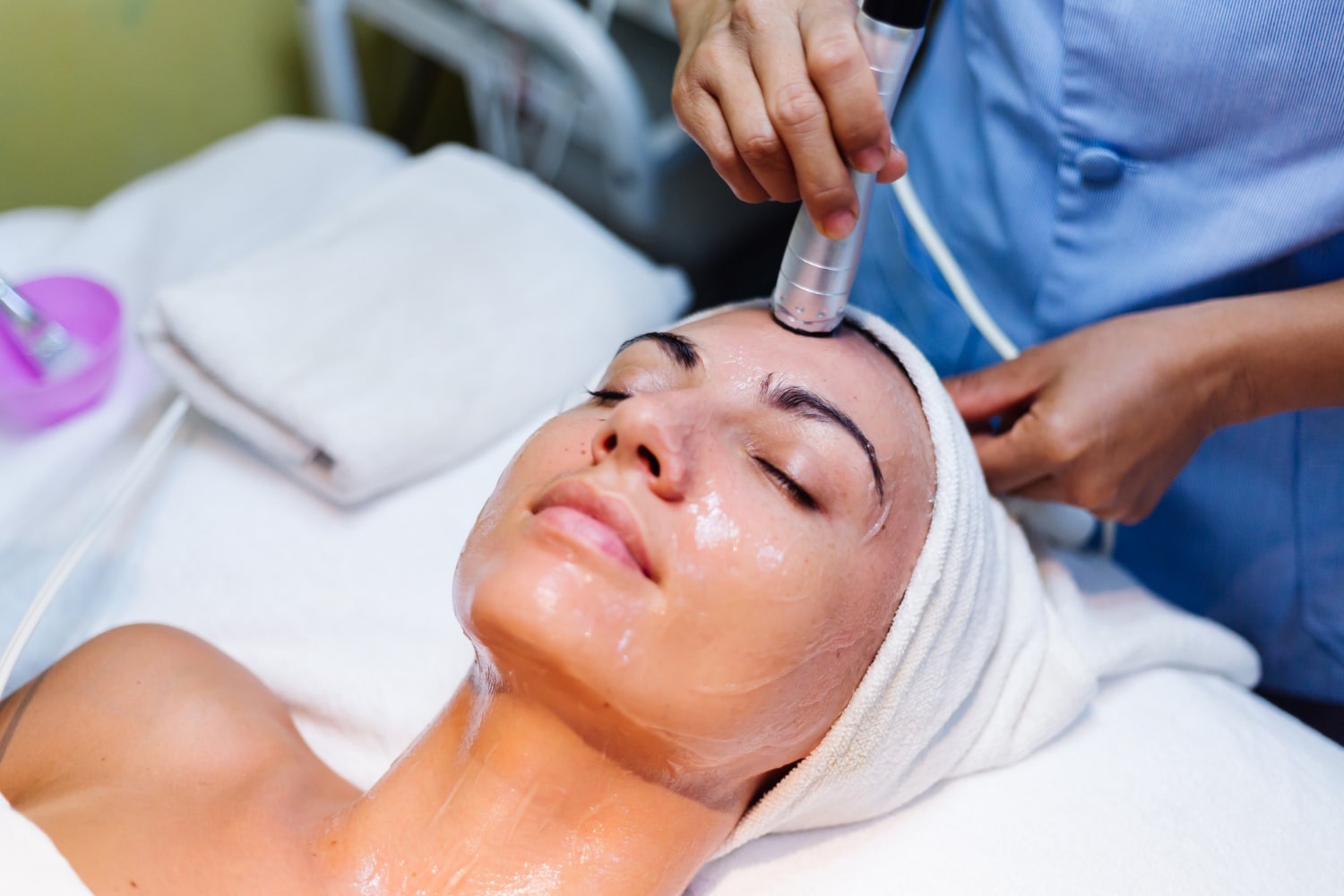 young-woman-lying-cosmetologist-s-table-during-rejuvenation-procedure-min